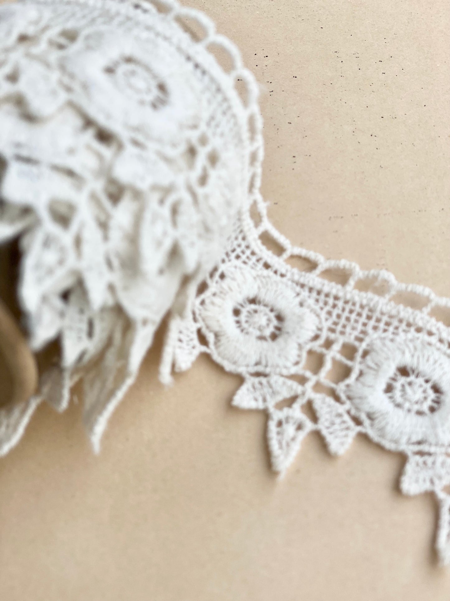 wooden vintage spool with rose lace.