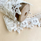 wooden vintage spool with rose lace.