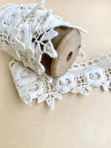 wooden  spool with rose lace.