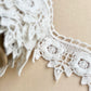 wooden vintage spool with rose lace.