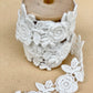 vintage rose garland lace on a wooden spool