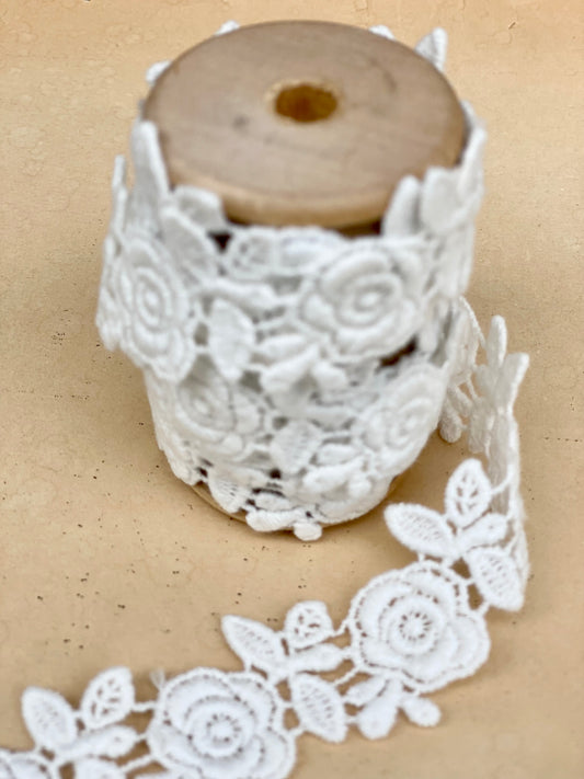 vintage rose garland lace on a wooden spool