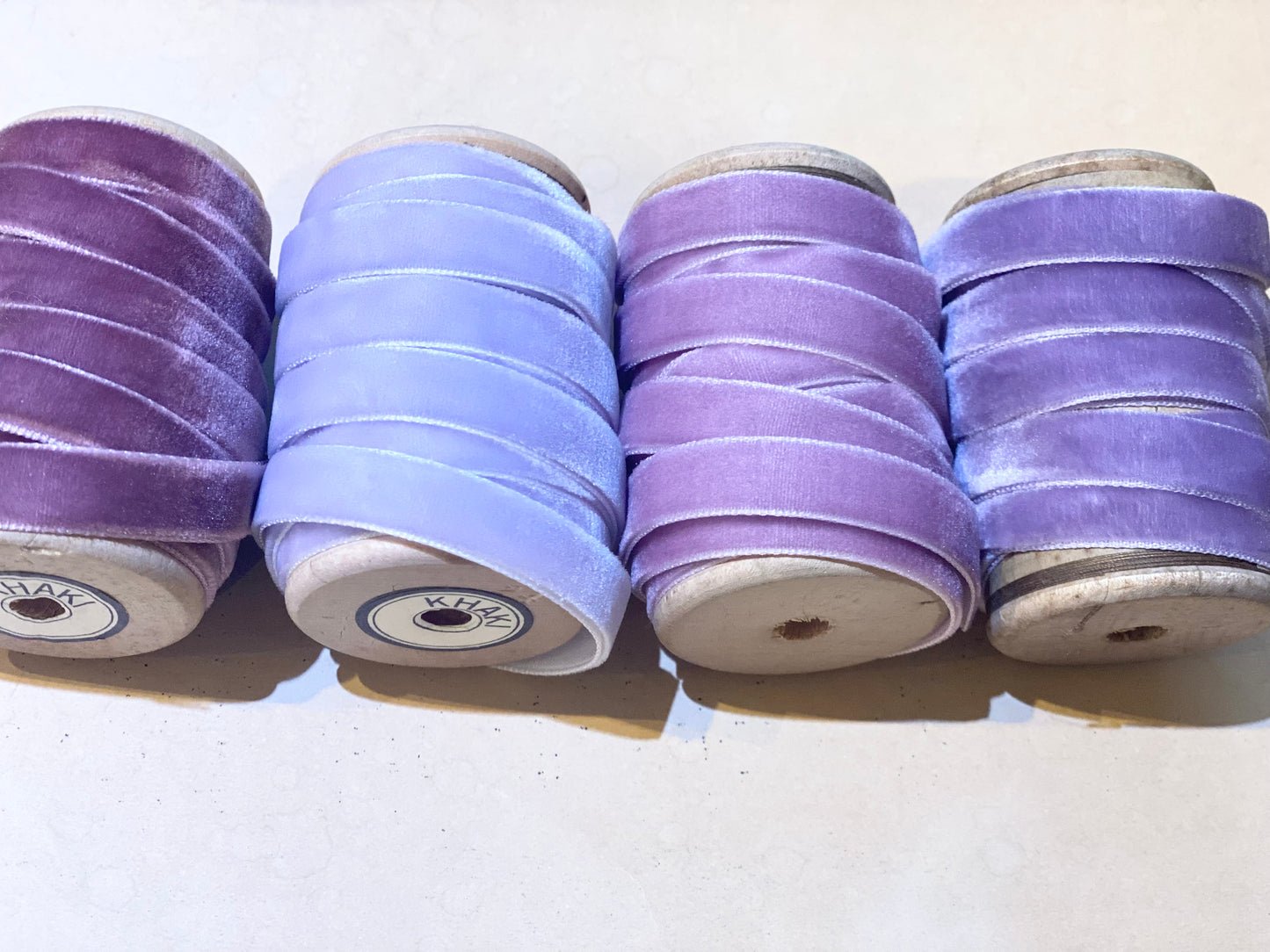 Lavender Palace collection of velvet ribbons on vintage wooden spools