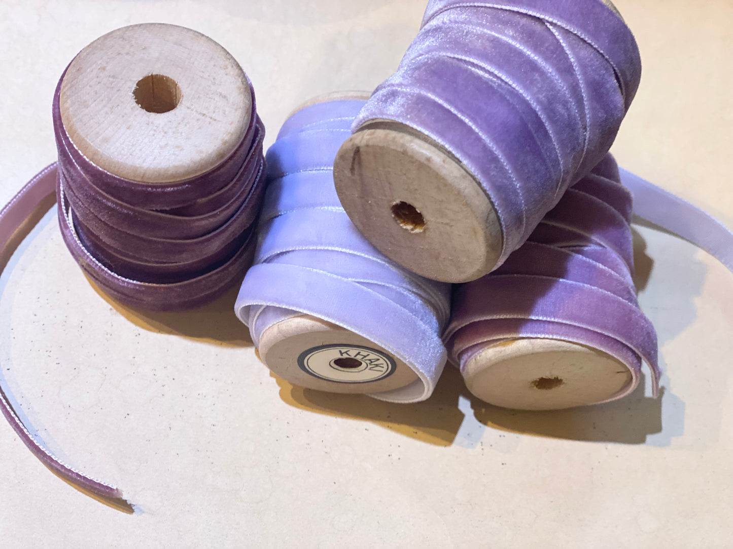 Lavender Palace collection of velvet ribbons on vintage wooden spools