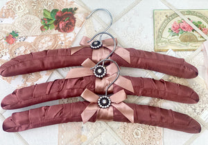 Coathangers. set of 3 . Mahogany Satin with embellishment button.