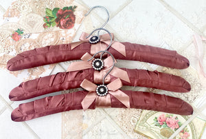 Coathangers. set of 3 . Mahogany Satin with embellishment button.