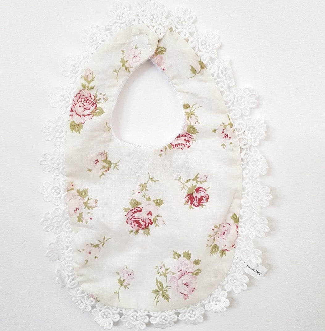 Baby bib. floral prints.