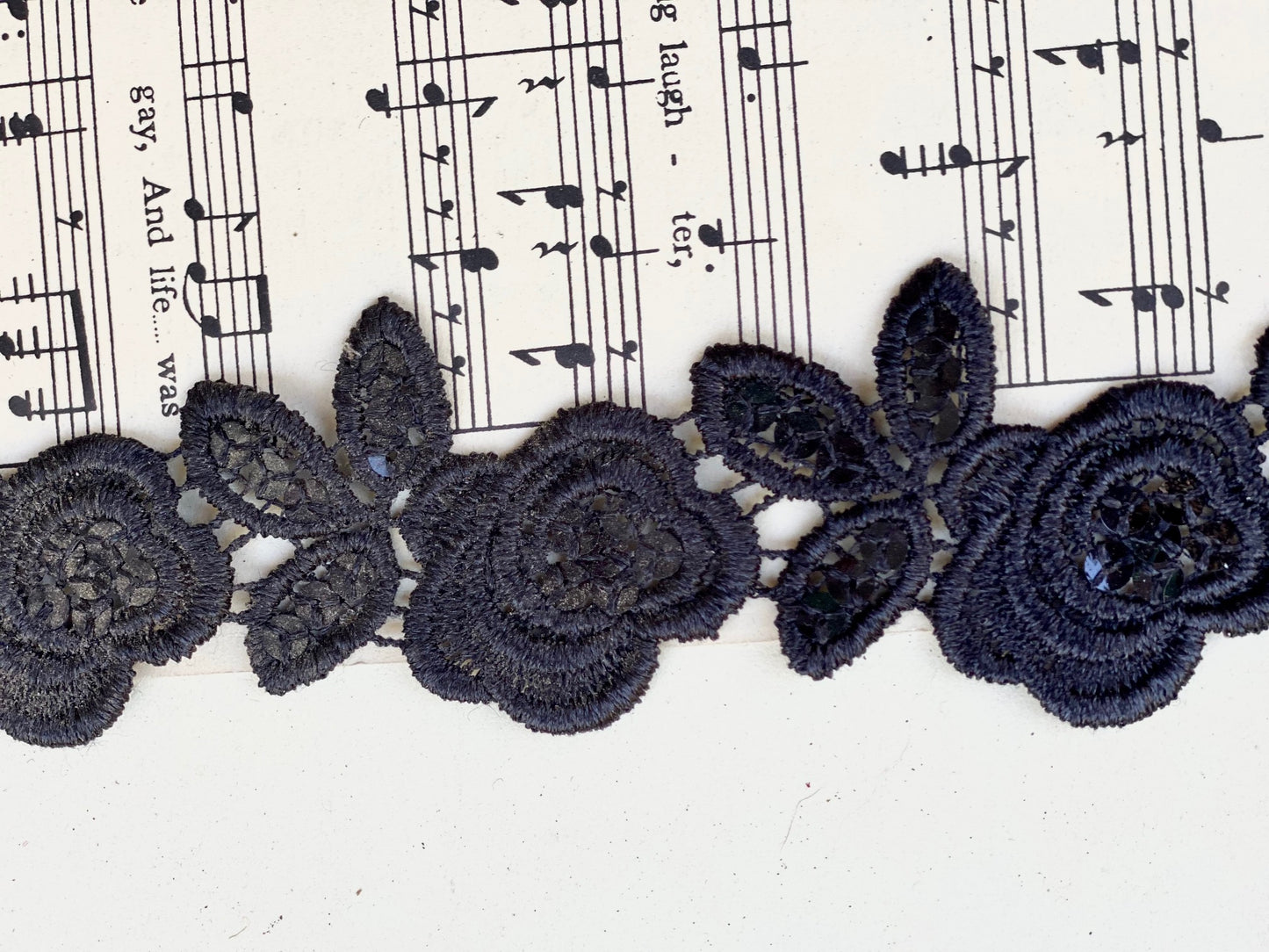 Beaded black rose lace trim.