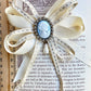 Vintage cameo and ribbon brooch.