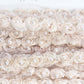rosebud trim with pearls . vanilla